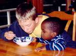 Ben intently studying J.T.’s food!