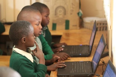 Photo of boy thinking in computer class.