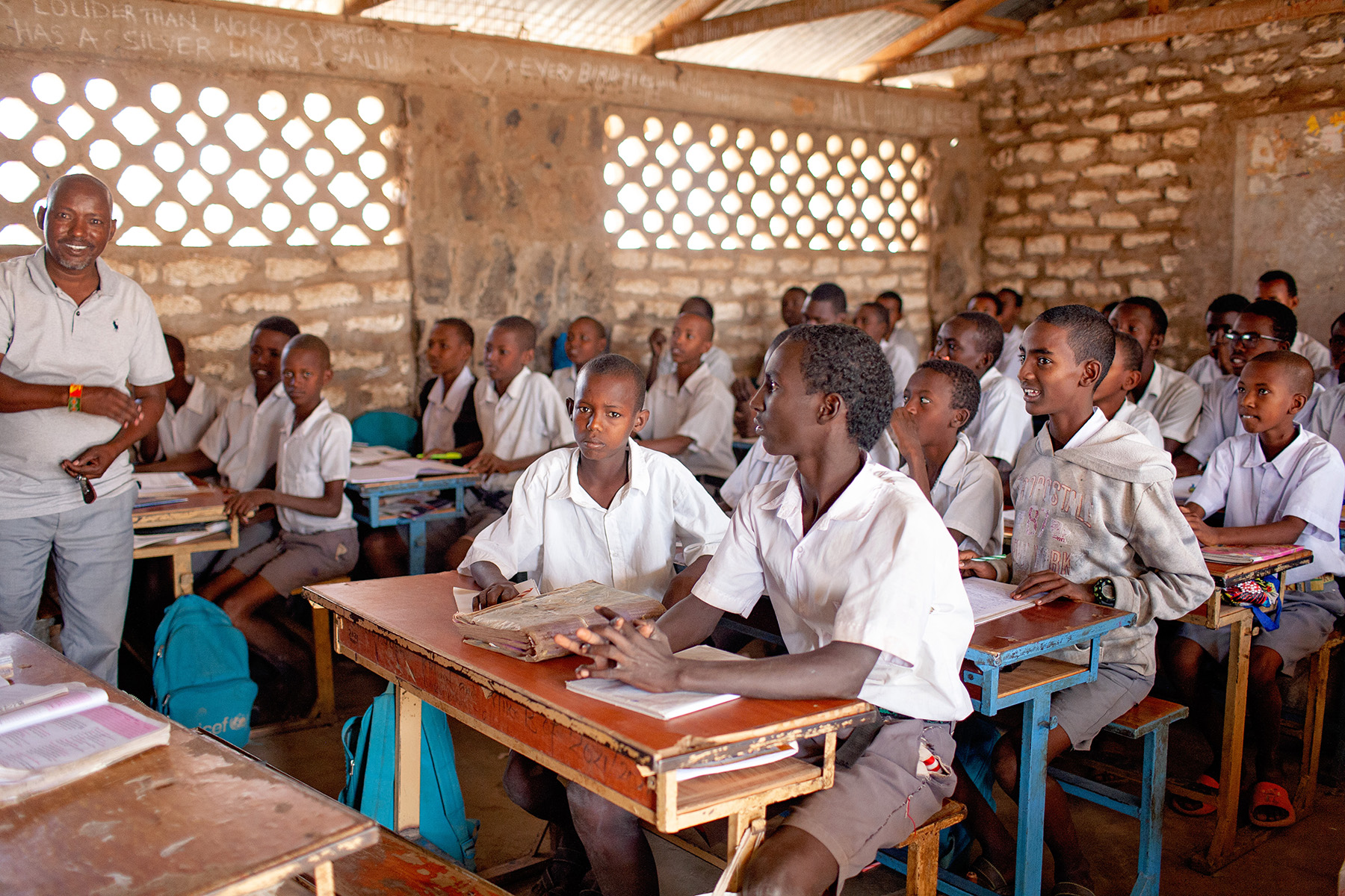 students sitting at desks in a classroom
