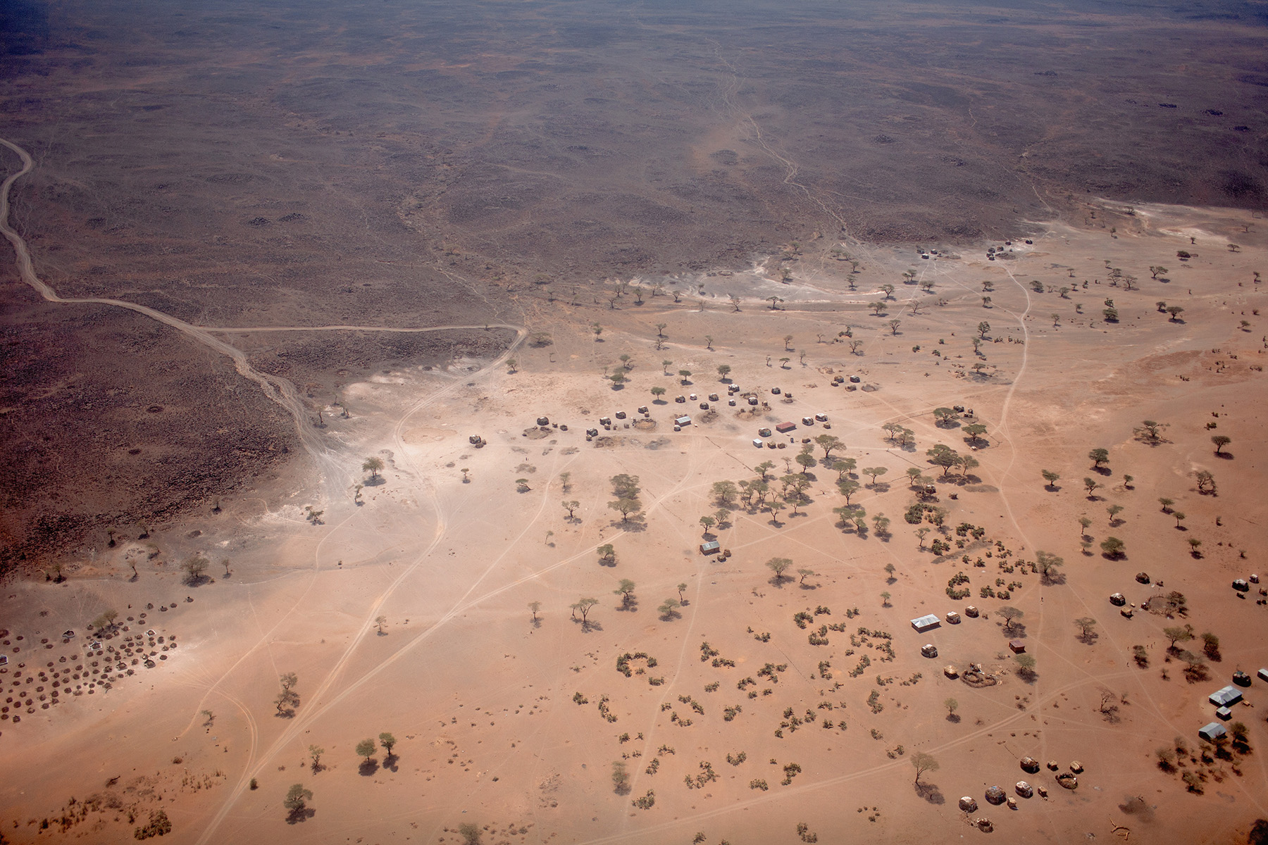 Aerial view of Northern Kenya arid landscape and houses